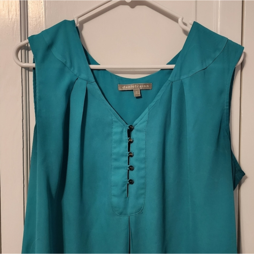 Super cute green tank with covered shoulders and button accents. Elegant cute. M